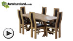 Watch 6ft x 3ft Solid Oak Crossed Leg Dining Table + 6 Curved Back Brown Leather Chairs video